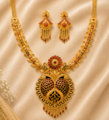 Peacock design gold plated necklace set with leaf motif chain, red meenakari pendant and matching fan-shaped tassel earrings