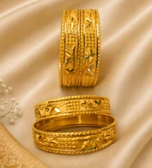 Gold plated carved bangles on cream silk