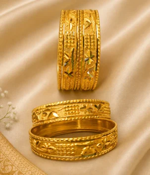 Gold plated carved bangles on cream silk