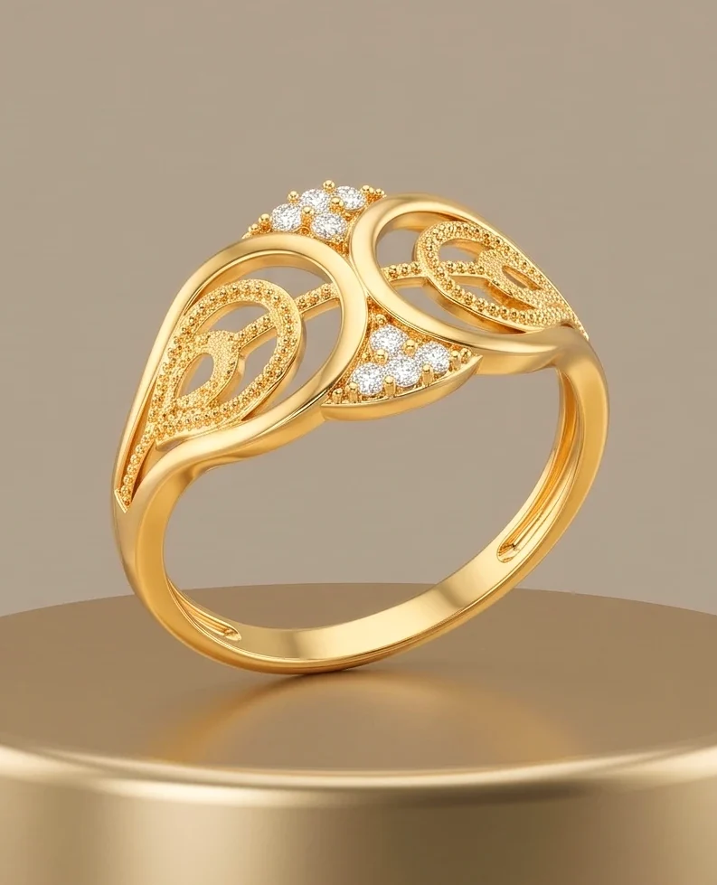 Gold plated ring with filigree and stone detailing on a pedestal