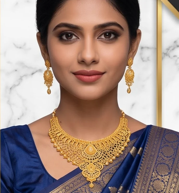 Woman in a blue silk saree wearing a gold plated necklace and bangles
